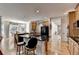 Open layout featuring an island, hardwood floors, granite countertops and stainless steel appliances at 2123 Floral Ridge Dr, Dacula, GA 30019