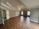 Large living room boasting hardwood floors, trey ceiling and multiple windows at 2123 Floral Ridge Dr, Dacula, GA 30019