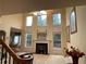 Bright living room with fireplace and large windows and neutral decor at 2123 Floral Ridge Dr, Dacula, GA 30019