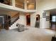 Inviting living room featuring a staircase, second-story overlook, and tall ceilings for a feeling of grandeur at 2123 Floral Ridge Dr, Dacula, GA 30019