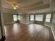 Spacious living room with hardwood floors, ceiling fan, and plenty of natural light at 2123 Floral Ridge Dr, Dacula, GA 30019