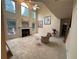 Sun-filled living room featuring a fireplace, large windows, and a staircase offering a warm and inviting ambiance at 2123 Floral Ridge Dr, Dacula, GA 30019