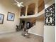 Grand living room with soaring ceilings, staircase with iron railings, and a bright, open feel at 2123 Floral Ridge Dr, Dacula, GA 30019