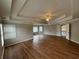 Spacious main bedroom with tray ceiling, wood floors, and ensuite bathroom at 2123 Floral Ridge Dr, Dacula, GA 30019