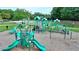 Bright green playground with multiple slides and climbing structures set in a community park at 2123 Floral Ridge Dr, Dacula, GA 30019