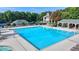 Large, inviting community swimming pool with lounge areas, a jacuzzi, and gazebo with fireplace at 2123 Floral Ridge Dr, Dacula, GA 30019