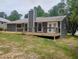 Home featuring an outdoor wood deck and vinyl siding at 2645 Trotters Walk Trl, Snellville, GA 30078