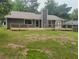 Home featuring an outdoor wood deck and vinyl siding at 2645 Trotters Walk Trl, Snellville, GA 30078