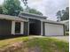 Beautiful home featuring white trim and a spacious two-car garage at 2645 Trotters Walk Trl, Snellville, GA 30078