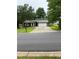 Charming single-Gathering home featuring a driveway and a well-maintained front lawn at 2645 Trotters Walk Trl, Snellville, GA 30078