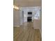 Modern kitchen featuring white cabinetry, stainless steel appliances, and light wood flooring at 2645 Trotters Walk Trl, Snellville, GA 30078