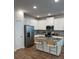 Modern kitchen featuring white cabinets, granite countertops, stainless steel appliances and a central island at 4265 Sw Notting Hill Sw Dr, Atlanta, GA 30331