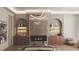 Elegant bedroom featuring a cozy fireplace, built-in shelves, and decorative lighting at 654 Longleaf Dr, Atlanta, GA 30342
