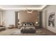 Spacious bedroom features hardwood floors, paneled accent wall, modern lighting fixture, and neutral color palette at 654 Longleaf Dr, Atlanta, GA 30342