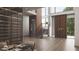 Luxurious foyer featuring soaring ceilings, wood floors, an elevator, modern staircase, and a custom wine storage display at 654 Longleaf Dr, Atlanta, GA 30342