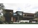 Modern home exterior boasts clean lines, large windows, and a well-manicured lawn, creating a sophisticated curb appeal at 654 Longleaf Dr, Atlanta, GA 30342