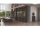 Open-concept living area with wine display, dining table, elegant chairs, and large windows offering natural light at 654 Longleaf Dr, Atlanta, GA 30342