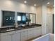 Modern bathroom featuring double vanity with gray countertops and framed mirrors at 750 Keystone Dr, Woodstock, GA 30188
