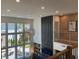 Bright living room with lots of windows, view of backyard and pendant lights at 750 Keystone Dr, Woodstock, GA 30188