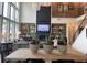 Bright living room with soaring ceilings, custom shelving, and a cozy fireplace is the perfect place to relax or entertain at 750 Keystone Dr, Woodstock, GA 30188