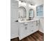 Elegant bathroom with double vanity, modern fixtures, and framed mirrors at 3420 Burnt Hickory Nw Rd, Marietta, GA 30064