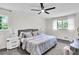 Cozy bedroom with soft carpet, ceiling fan, and neutral decor featuring natural light at 3420 Burnt Hickory Nw Rd, Marietta, GA 30064