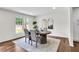 Well-lit dining room with hardwood floors and view to the home's exterior at 3420 Burnt Hickory Nw Rd, Marietta, GA 30064