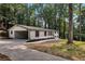 Single story home with a 2-car carport and a concrete driveway lined with fresh landscaping at 3420 Burnt Hickory Nw Rd, Marietta, GA 30064