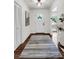 Inviting foyer with modern rug and light fixture and view to formal spaces at 3420 Burnt Hickory Nw Rd, Marietta, GA 30064
