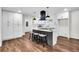 Bright kitchen featuring an island with stool seating and pendant lighting at 3420 Burnt Hickory Nw Rd, Marietta, GA 30064