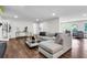 Bright living room with hardwood floors, fireplace, and neutral furniture, complemented by natural light at 3420 Burnt Hickory Nw Rd, Marietta, GA 30064