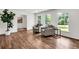 Bright living room with hardwood floors, neutral paint, and large windows at 3420 Burnt Hickory Nw Rd, Marietta, GA 30064