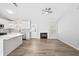 Open concept living space with a modern kitchen, fireplace, and hardwood flooring at 5950 Milligan Ct, Atlanta, GA 30349