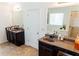 Large bathroom with dual sinks, granite counters, and two vanities at 6175 Beaver Crossing Dr, Cumming, GA 30040