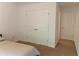 Neutral bedroom with a closet and a bed at 6175 Beaver Crossing Dr, Cumming, GA 30040