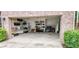 Spacious two-car garage with built in shelving units for organized storage at 6175 Beaver Crossing Dr, Cumming, GA 30040