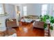 Inviting living room with hardwood floors, large windows, and comfortable neutral-toned furniture at 6175 Beaver Crossing Dr, Cumming, GA 30040