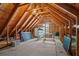 Spacious unfinished attic area, ideal for storage or customization, with exposed wood beams at 1028 Southwood Dr, Villa Rica, GA 30180