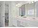 Bathroom featuring a double vanity, linen closet, and separate toilet at 1028 Southwood Dr, Villa Rica, GA 30180