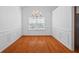 Formal dining room with wood floors, wainscoting, and a chandelier at 1028 Southwood Dr, Villa Rica, GA 30180