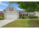 Charming single-Gathering home featuring a two-car garage and well-manicured lawn at 1028 Southwood Dr, Villa Rica, GA 30180