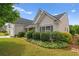 Lovely home with lush landscaping, front porch, and attached garage at 1028 Southwood Dr, Villa Rica, GA 30180