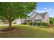 Attractive house with a well-groomed lawn, mature trees, and traditional siding at 1028 Southwood Dr, Villa Rica, GA 30180