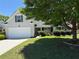 Beautiful home with lush landscaping, a two-car garage, and a welcoming front porch at 1028 Southwood Dr, Villa Rica, GA 30180