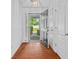 Bright foyer with hardwood floors, a view to the outside, and classic trim at 1028 Southwood Dr, Villa Rica, GA 30180