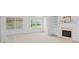 Bright living room featuring a fireplace, built-in shelves, and large windows with a view at 1028 Southwood Dr, Villa Rica, GA 30180