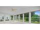 Sunroom features a ceiling fan, lots of windows, and neutral carpet at 1028 Southwood Dr, Villa Rica, GA 30180