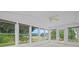 Bright sunroom with large windows offering beautiful views of the landscaped yard at 1028 Southwood Dr, Villa Rica, GA 30180