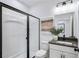 Bathroom with glass-enclosed shower and modern fixtures at 2905 Medford Drive, Cumming, GA 30041