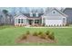 Charming single-story home with a manicured lawn, attached garage, and welcoming front porch at 2905 Medford Drive, Cumming, GA 30041